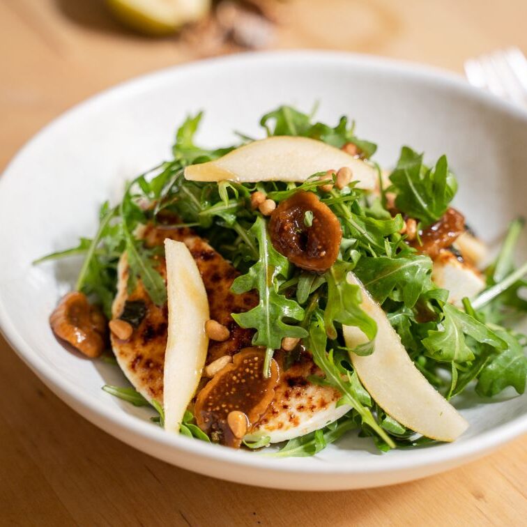 Baby rocket with caramelized manouri cheese